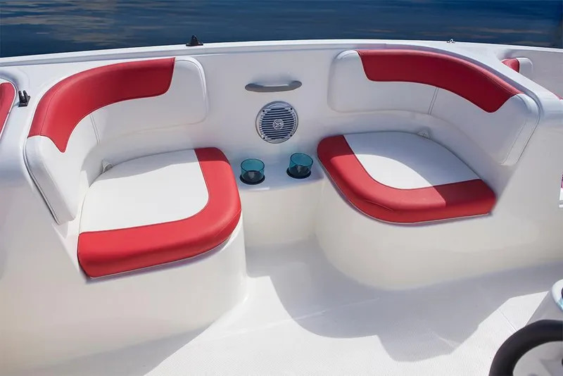 Slide: The Image of 2023 Bayliner Element E18 boat with red and white seating and cup holders. - 22