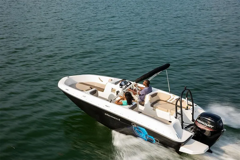Slide: The Image of 2023 Bayliner Element E18 boat cruising on open water. - 26