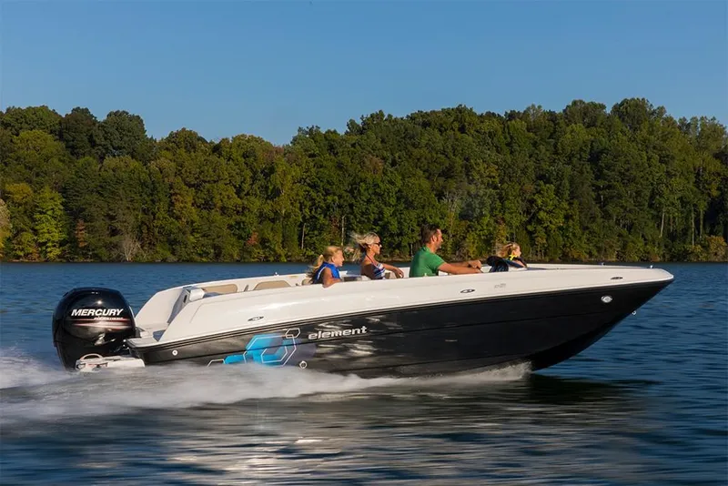 Slide: The Image of 2023 Bayliner Element E21 boat cruising on a lake with passengers. - 15