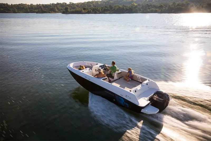 Slide: The Image of 2023 Bayliner Element E21 boat cruising on a serene lake. - 16