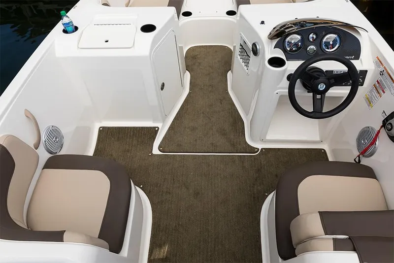 Slide: The Image of 2023 Bayliner Element E21 boat interior with beige and brown seating, steering console, and carpeted floor. - 18