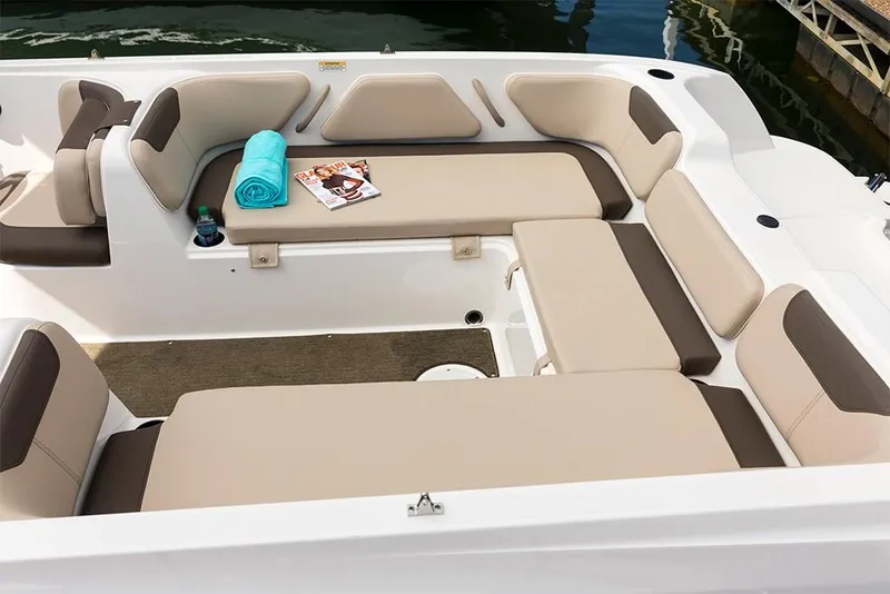 Slide: The Image of 2023 Bayliner Element E21 boat interior with beige and brown seating. - 20