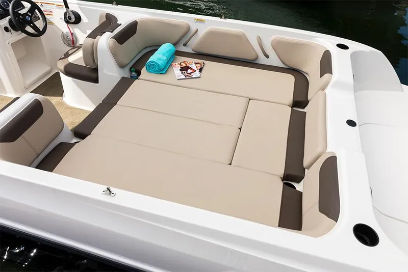 Slide: The Image of 2023 Bayliner Element E21 boat interior with spacious seating and sunbathing area. - 21