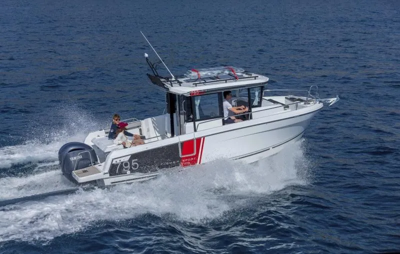 Slide: The Image of 2023 Jeanneau NC795 Sport Series 2 boat cruising on water. - 15