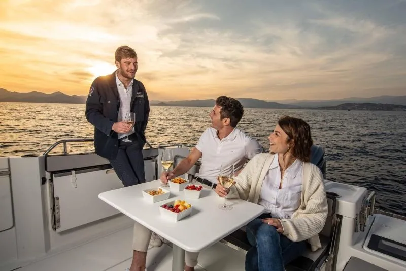 Slide: The Image of 2023 Jeanneau NC795 Sport Series 2 boat on water near colorful buildings. - 31