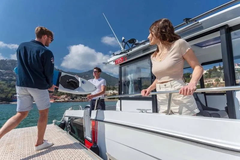 Slide: The Image of 2023 Jeanneau NC795 Sport Series 2 boat cruising on the water. - 6