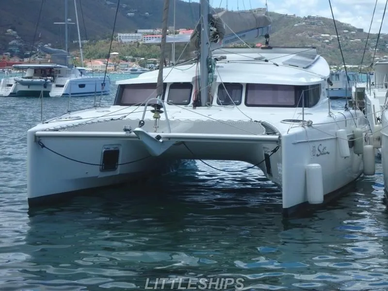Slide: The Image of 2015 Fountaine Pajot MAHE EVO catamaran docked in harbor. - 10