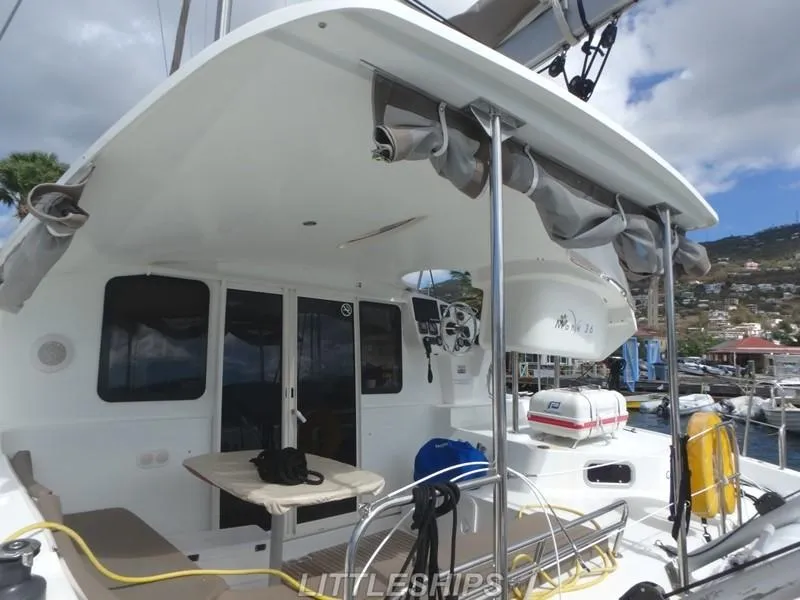 Slide: The Image of Fountaine Pajot MAHE EVO 2015 catamaran at dock with seating area. - 11