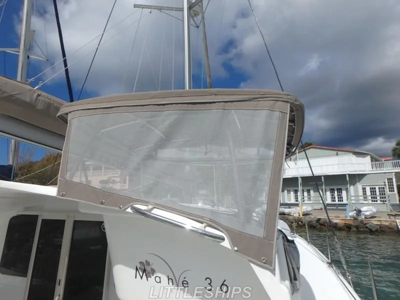 Slide: The Image of Fountaine Pajot MAHE EVO 2015 catamaran docked, cloudy sky. - 16