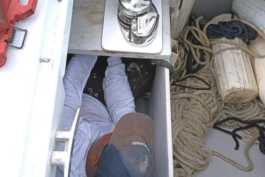 Slide: The Image of Person working in a compartment on a 2015 Fountaine Pajot MAHE EVO catamaran. - 189