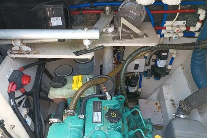 Slide: The Image of Engine compartment of 2015 Fountaine Pajot MAHE EVO catamaran, showcasing mechanical components and wiring. - 192