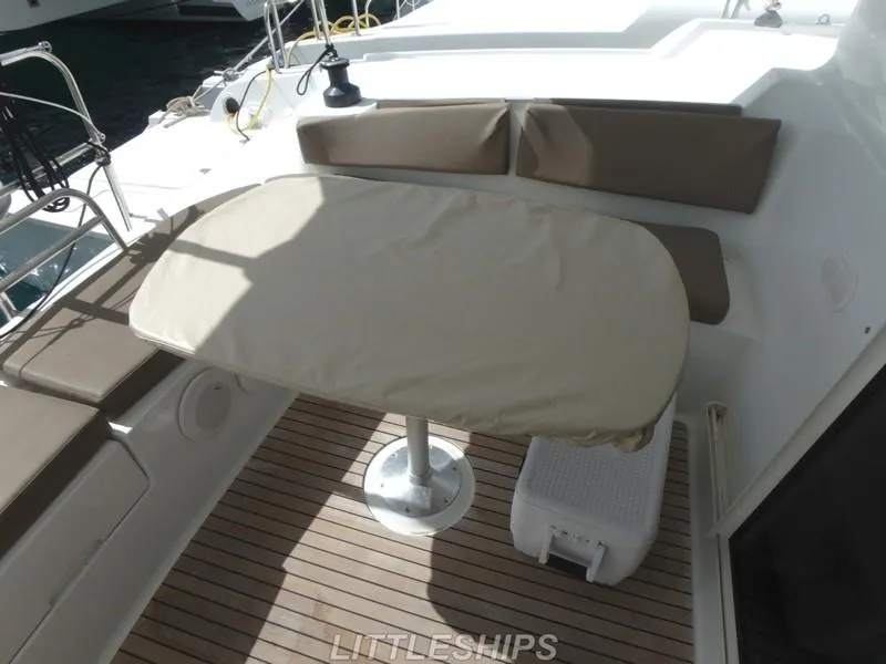 Slide: The Image of 2015 Fountaine Pajot MAHE EVO yacht deck with table and seating. - 22