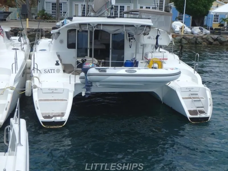 Slide: The Image of Fountaine Pajot MAHE EVO 2015 catamaran docked at harbor. - 6