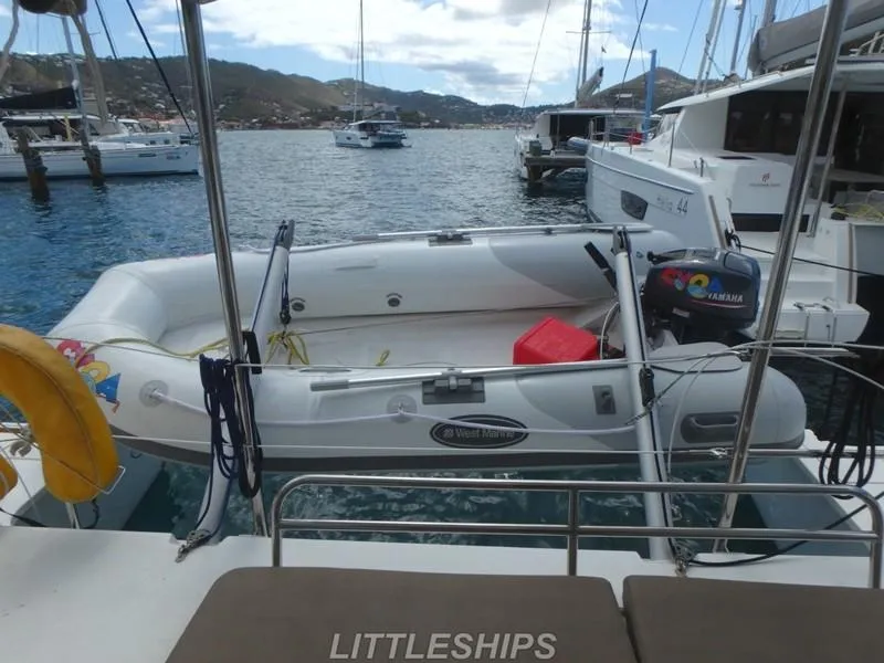 Slide: The Image of Fountaine Pajot MAHE EVO 2015 with dinghy in harbor. - 8