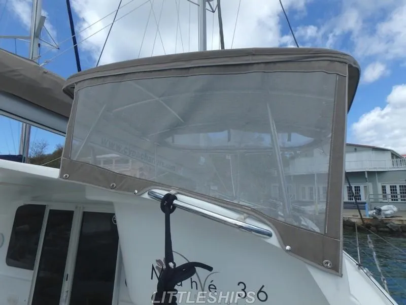 Slide: The Image of Fountaine Pajot MAHE EVO 2015 with canopy in harbor. - 9