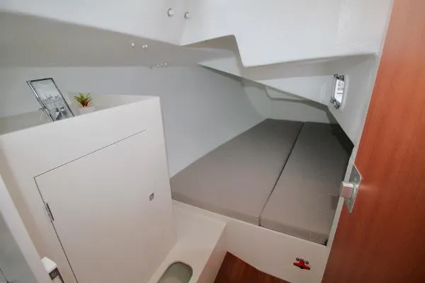 Slide: The Image of 2024 J Boats J/99 cabin interior with bed, storage, and modern design. - 18