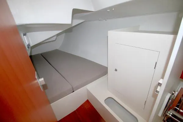 Slide: The Image of 2024 J Boats J/99 cabin interior with bed and storage compartment. - 19