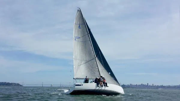 Slide: The Image of 2024 J Boats J/99 sailing on open water with crew onboard. - 7
