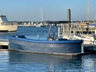 Slide: The Image of 2018 Lekker Damsko 750 Open boat docked at a marina, calm water, clear sky. - 11