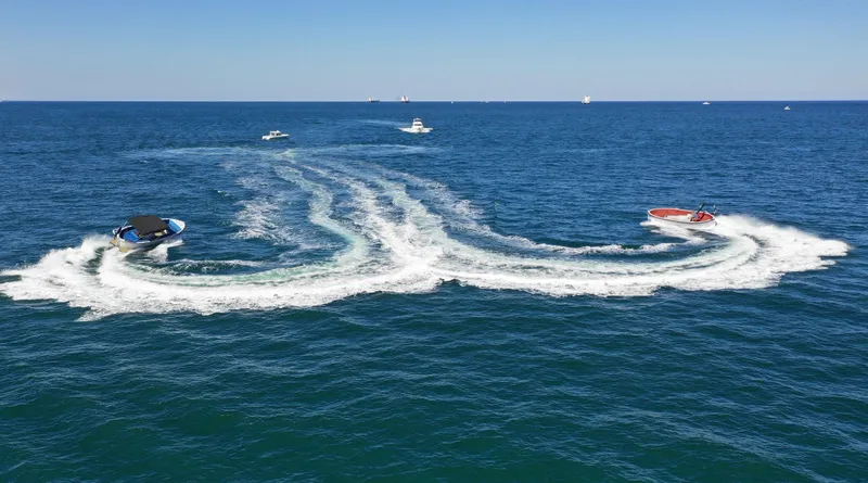 Slide: The Image of Boats creating wake patterns on the ocean, featuring a 2018 Lekker Damsko 750 - Open. - 4