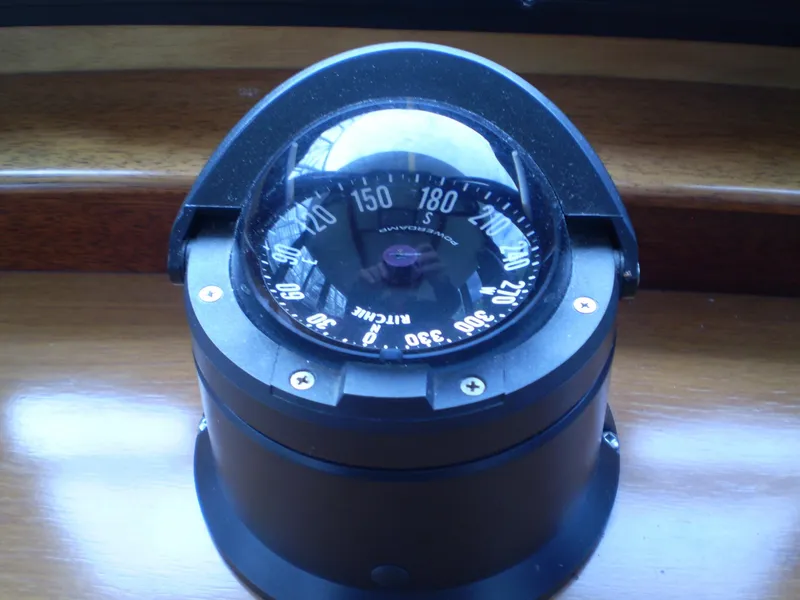 Slide: The Image of Boat compass on Devlin Surf Scoter, 2000 model, mounted on wooden surface. - 29