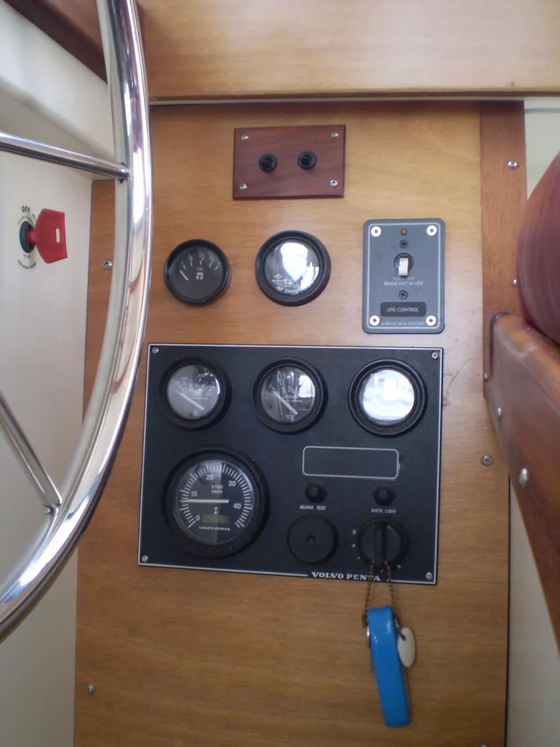 Slide: The Image of Control panel of a 2000 Devlin Surf Scoter boat with gauges and switches. - 30