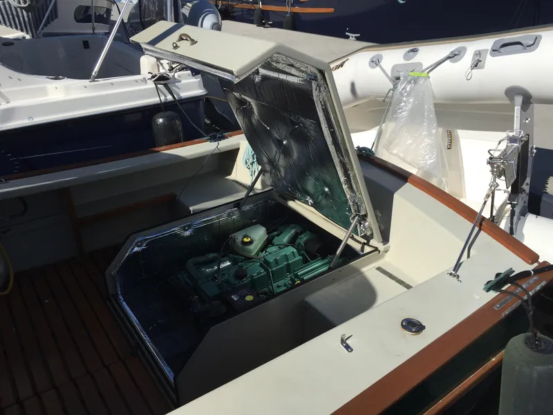 Slide: The Image of Open engine compartment of 2000 Devlin Surf Scoter boat, showcasing internal mechanics. - 41