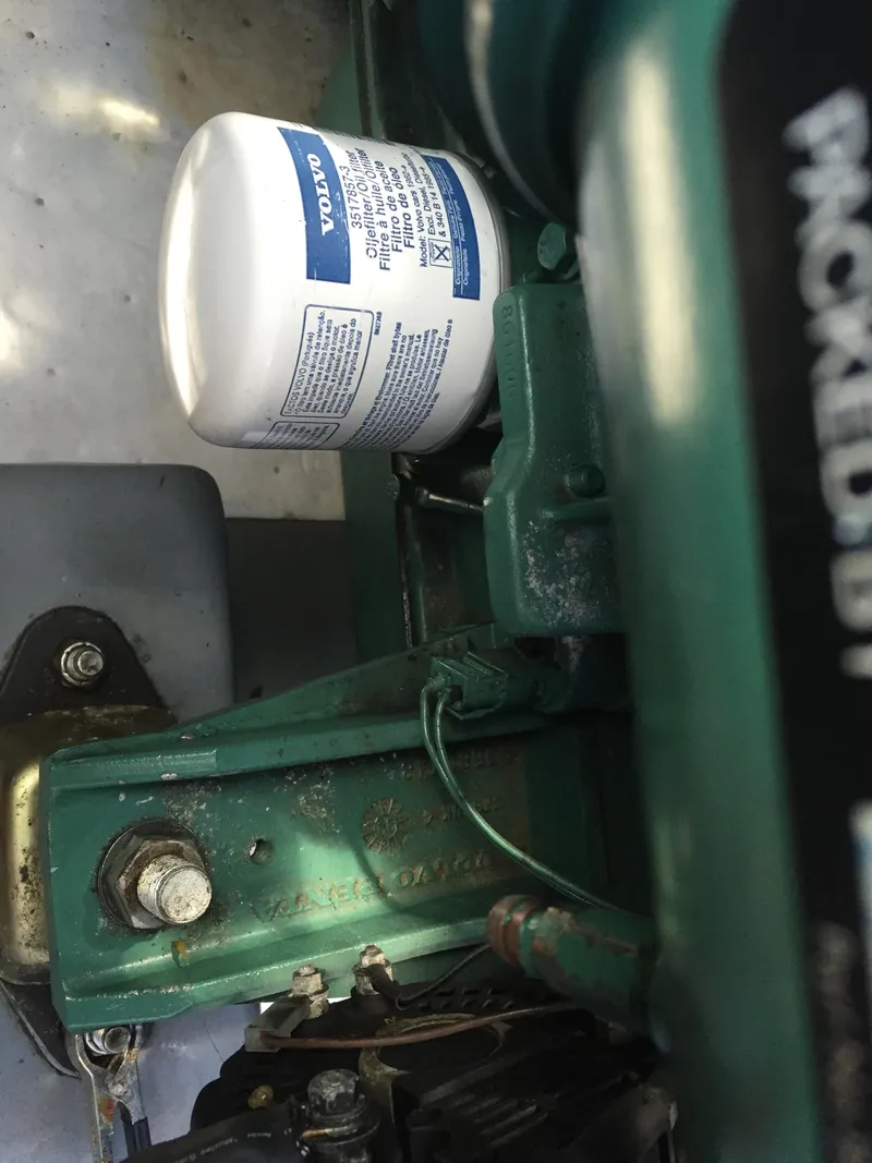 Slide: The Image of Engine compartment of a 2000 Devlin Surf Scoter with visible Volvo oil filter. - 45