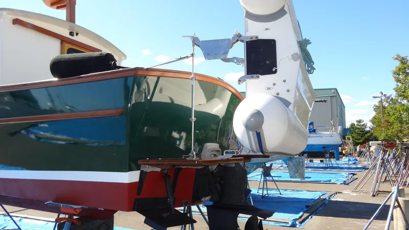 Slide: The Image of Devlin Surf Scoter 2000 boat on dry dock, showcasing hull and rudder. - 5