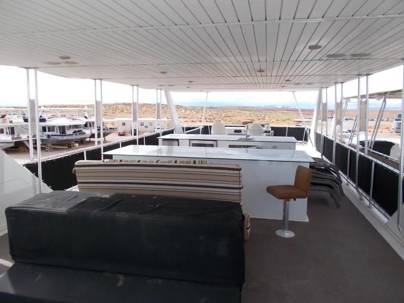 Slide: The Image of Spacious upper deck of 2013 Bravada Tranquility Trip 17 houseboat with seating and scenic views. - 11
