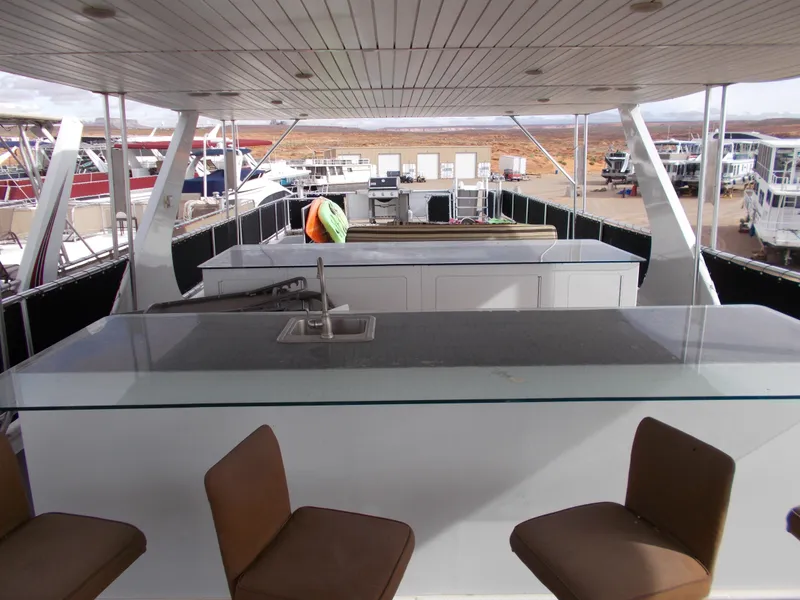 Slide: The Image of 2013 Bravada Tranquility Trip 17 houseboat interior with bar and seating area. - 13