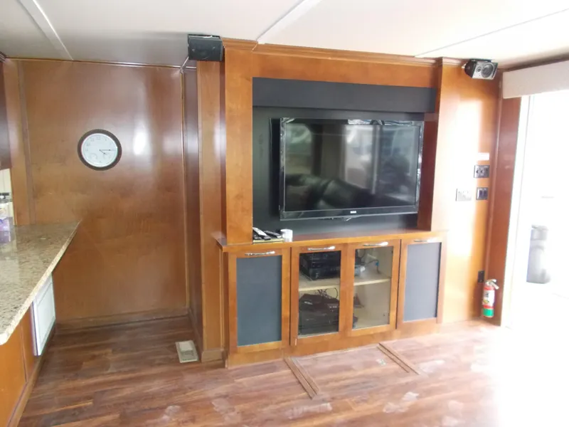 Slide: The Image of Interior of 2013 Bravada Tranquility Trip 17 with TV and wooden cabinetry. - 8