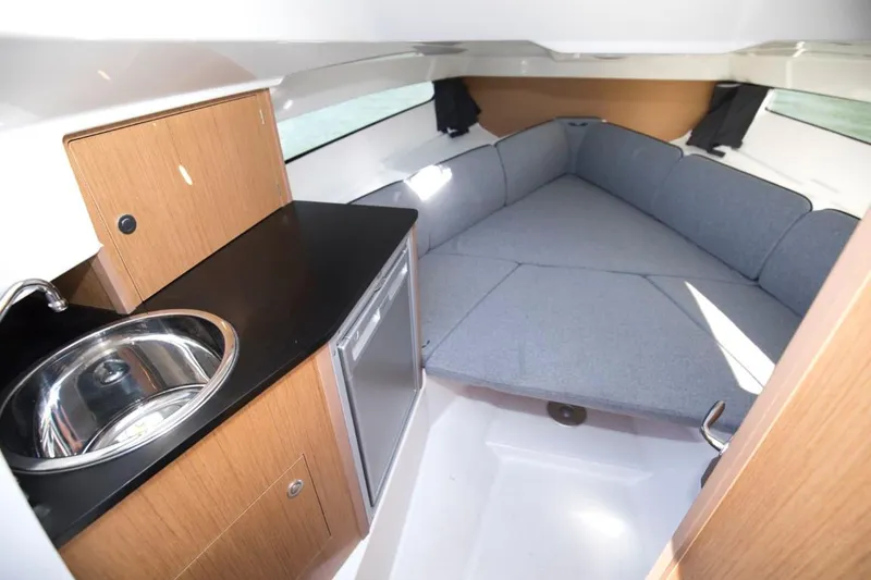 Slide: The Image of 2024 Beneteau Flyer 8 SUNdeck cabin with kitchenette and cozy seating area. - 14
