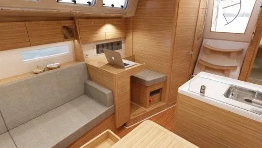 Slide: The Image of 2026 X-Yachts X 4.0 interior with modern wood finish and cozy seating area. - 9