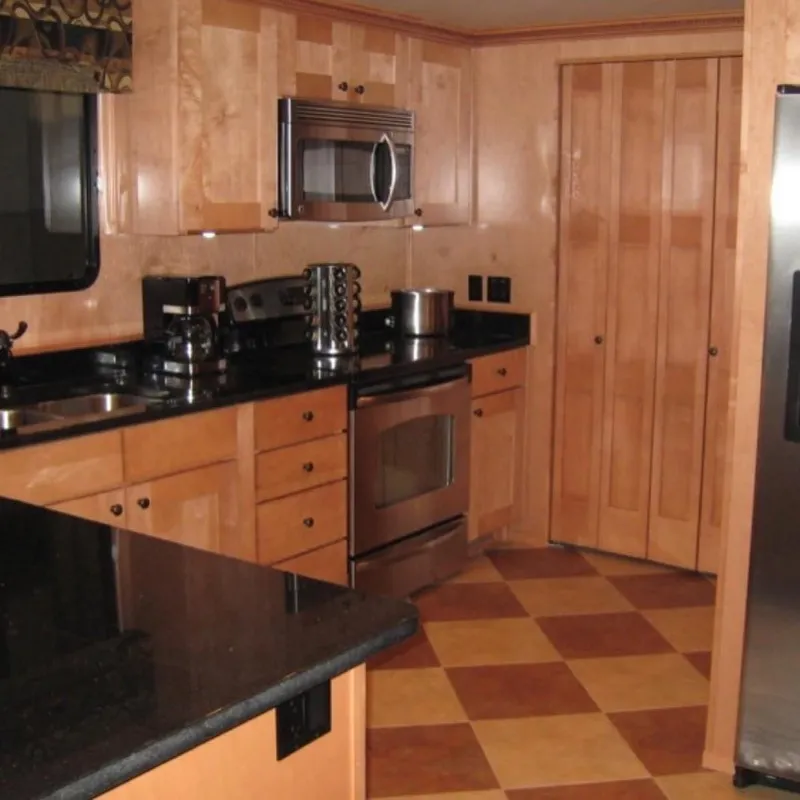 Slide: The Image of Modern kitchen in 2009 Sumerset Summer Breeze Trip15 houseboat with wood cabinets and stainless appliances. - 5