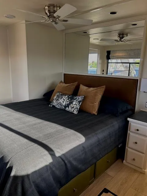 Slide: The Image of Sumerset Red Rocks Trip 11 2008 bedroom with bed, pillows, ceiling fan, and natural light. - 11