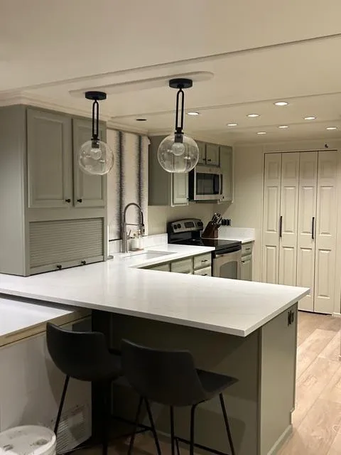 Slide: The Image of Modern kitchen in 2008 Sumerset Red Rocks Trip 11 houseboat with sleek countertops and pendant lighting. - 15