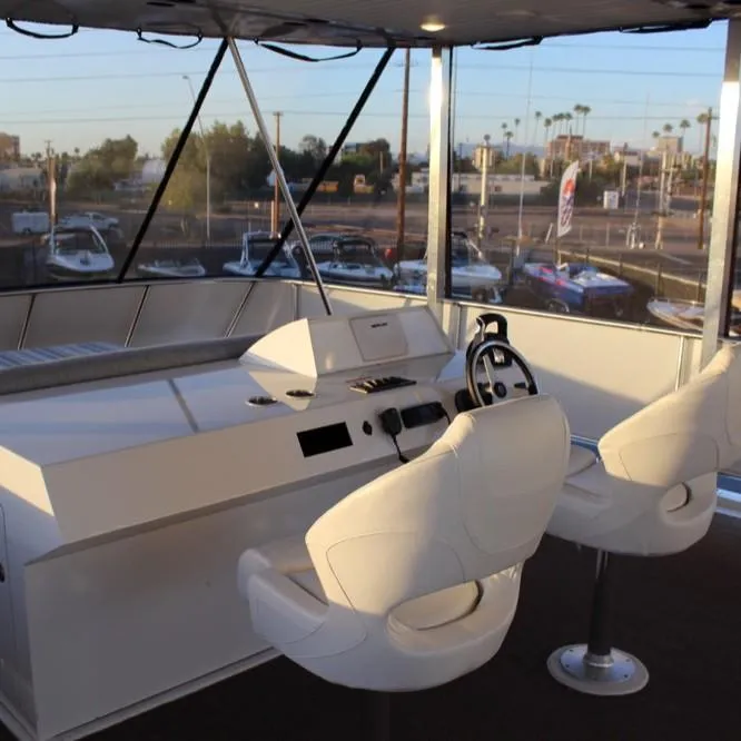 Slide: The Image of Helm of a 2015 Bravada Evolution Trip houseboat. - 16