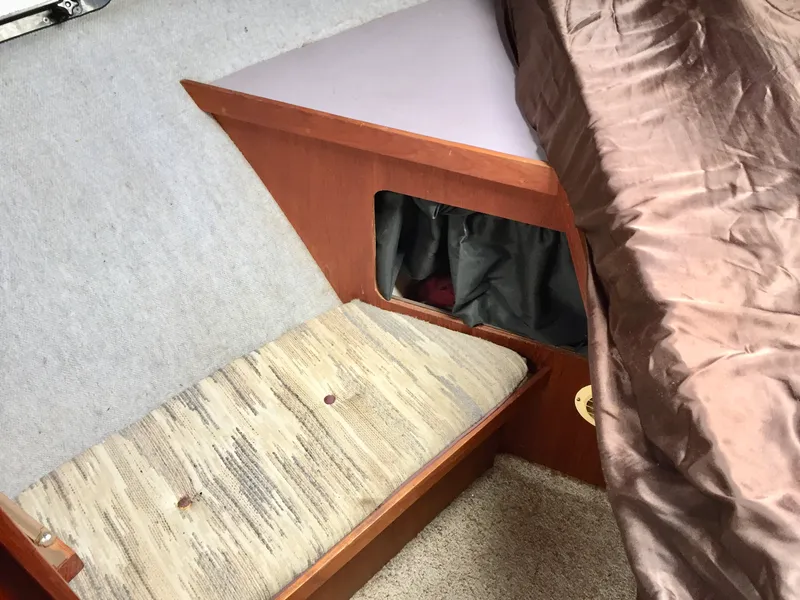 Slide: The Image of Interior cabin of 1986 Cruisers Yachts 336 Ultra Vee with seating and storage. - 12