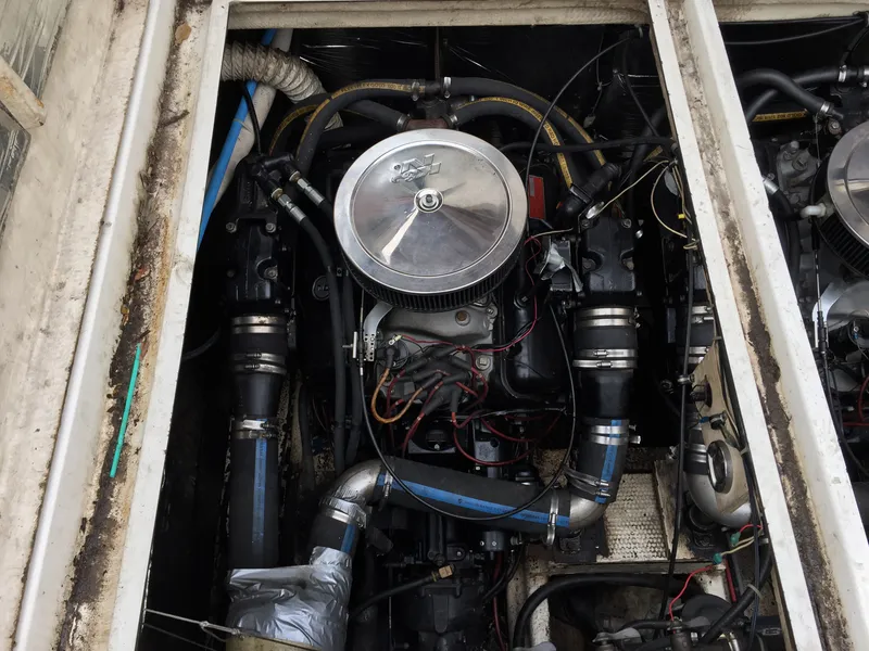 Slide: The Image of Engine compartment of 1986 Cruisers Yachts 336 Ultra Vee, showcasing mechanical components. - 17