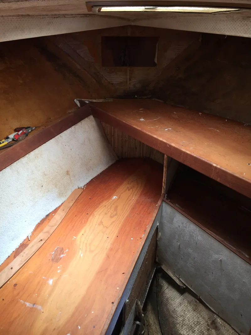 Slide: The Image of Interior of 1980 Trojan F-30 Flybridge Sedan, showing wooden cabin space. - 8