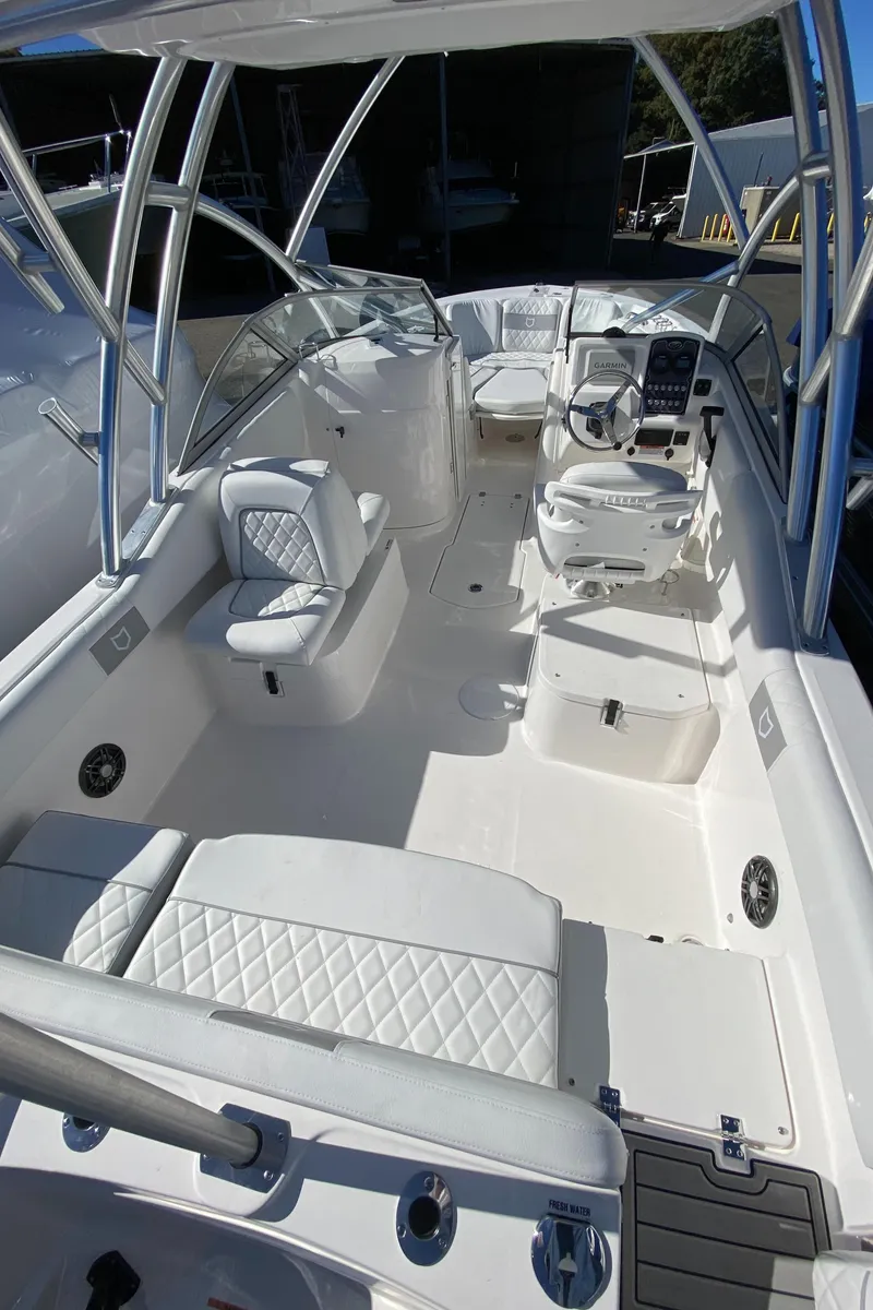 Slide: The Image of 2024 Sea Fox 228 Traveler boat interior with seating and helm station. - 3