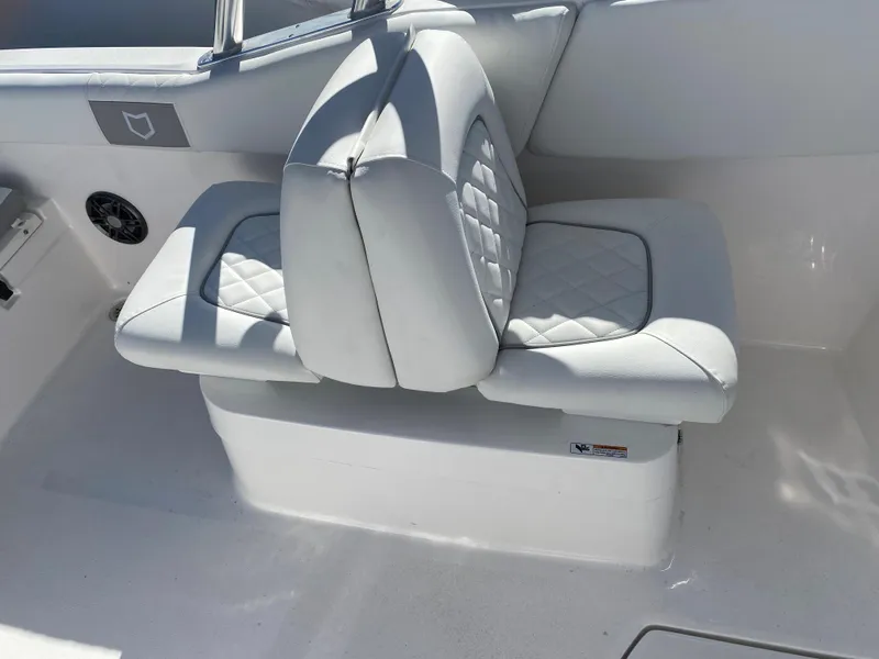 Slide: The Image of 2024 Sea Fox 228 Traveler boat with white cushioned seating. - 6