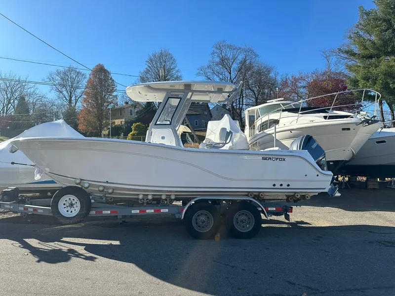 Slide: The Image of 2025 Sea Fox 248 Commander boat on trailer in outdoor setting. - 0