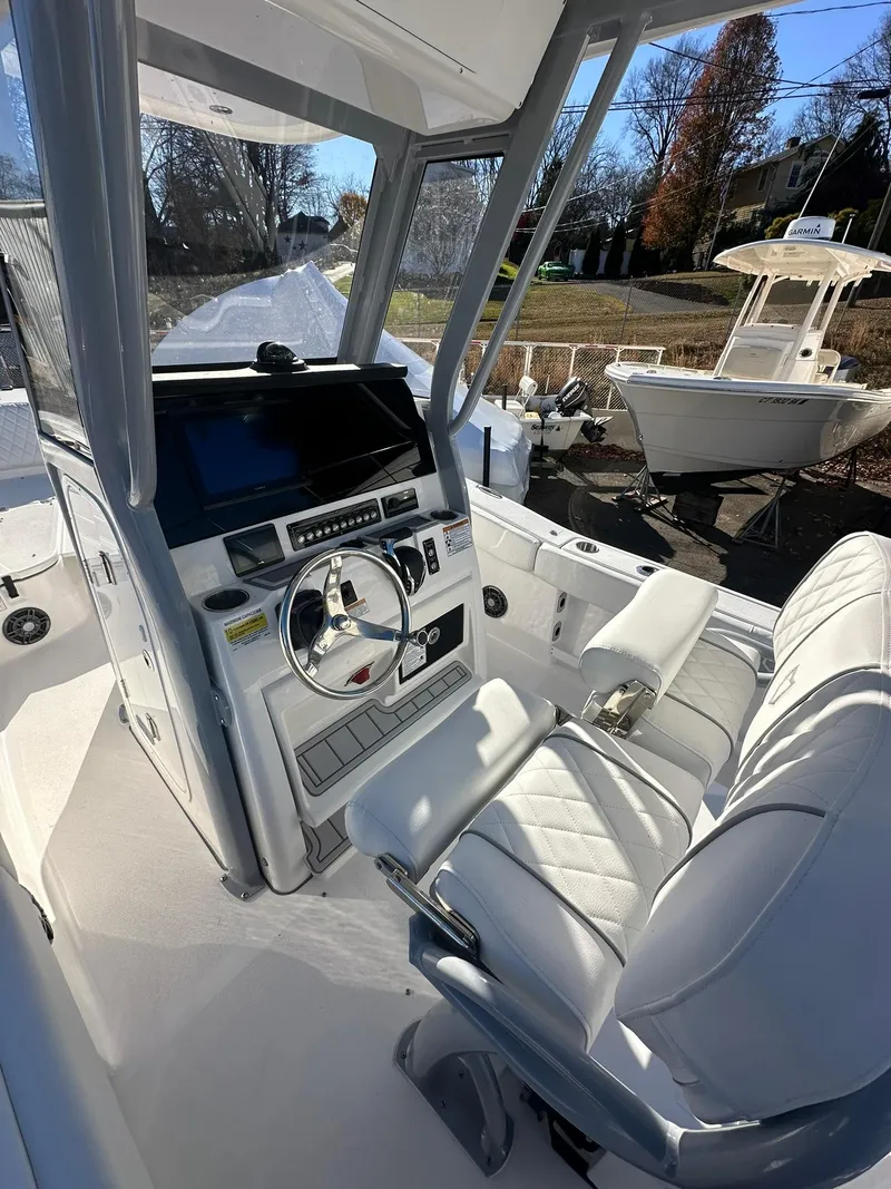 Slide: The Image of 2025 Sea Fox 248 Commander boat interior with modern helm and seating. - 12
