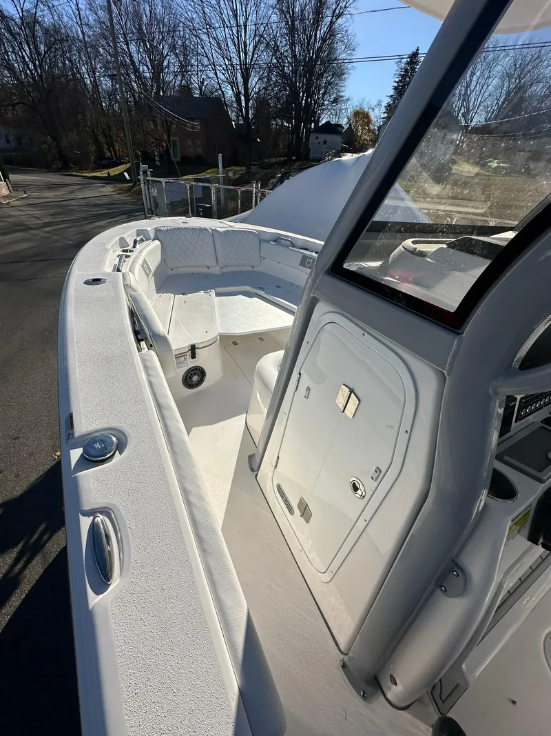 Slide: The Image of 2025 Sea Fox 248 Commander boat interior, spacious deck and seating area. - 15