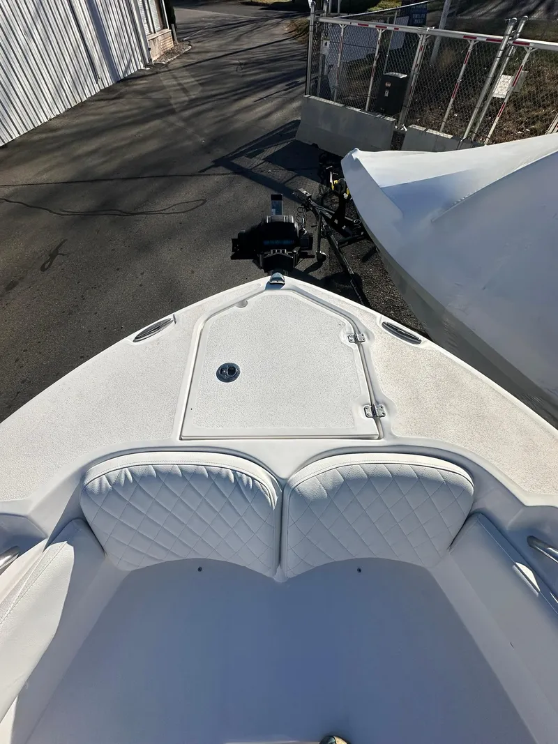 Slide: The Image of 2025 Sea Fox 248 Commander boat bow with cushioned seating and storage. - 20