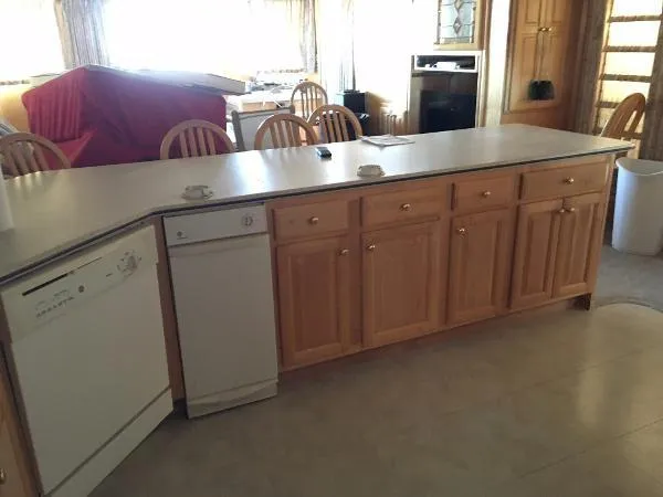 Slide: The Image of Spacious kitchen with wooden cabinets and dishwasher, Sharpe Just Because Trip 33, 2002 model. - 13