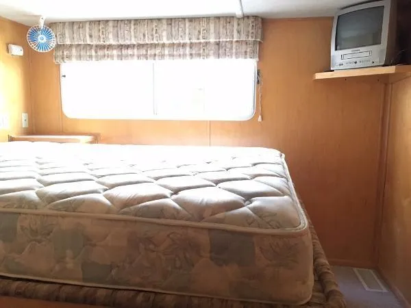 Slide: The Image of Cozy bedroom in 2002 Sharpe Just Because Trip 33 with TV and window. - 19