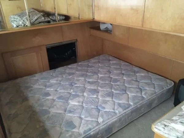 Slide: The Image of Small bedroom with a mattress in a 2002 Sharpe Just Because Trip 33 houseboat. - 23